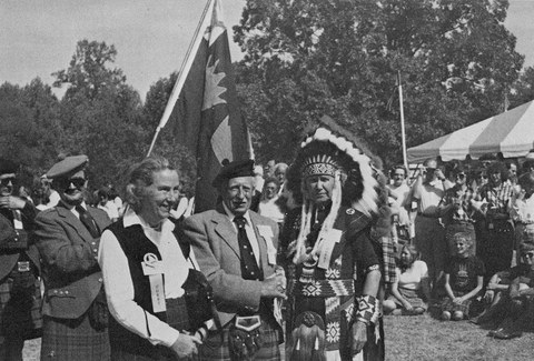 Photo of Patrick Grant and his wife with a man in north american first nations clothing in 1981
    