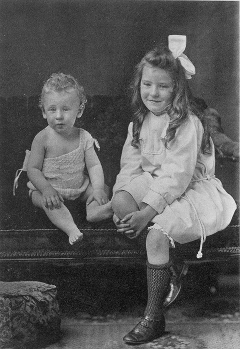 Photo of Sir Patrick as a toddler setting next to his older sister Lena
    